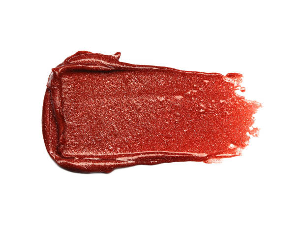 istock Liquid creamy smudged red lipstick isolated on white 1299263029