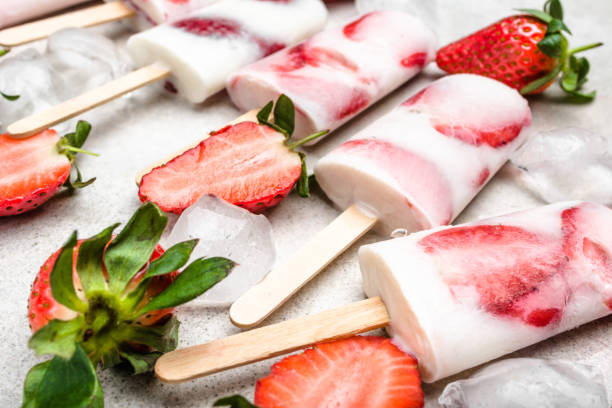 istock Strawberry ice cream on sticks - popsicles. Fruit lollipops. 1299265298