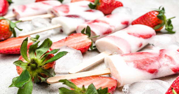 istock Fresh fruit popsicles. Strawberry ice cream frozen with berry and yogurt. 1299265392