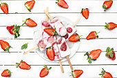 Fresh strawberry popsicle. Juicy fruit lollipops, fruity snack food for summer.