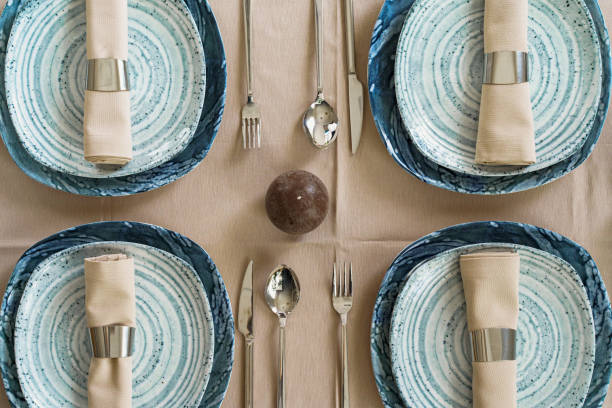 istock Details of a stylish table setting with textured ceramic dishes 1299265946