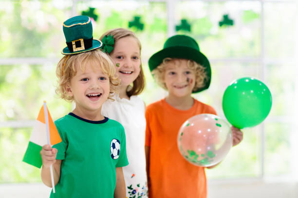 istock Kids celebrate St Patrick Day. Irish holiday. 1299266526