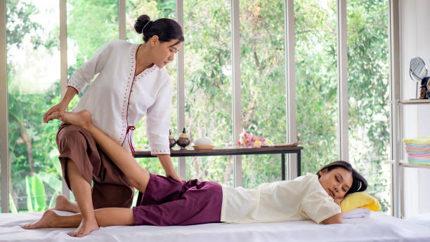 istock A beautiful girl happiness in spa with Thai massage 1299266837