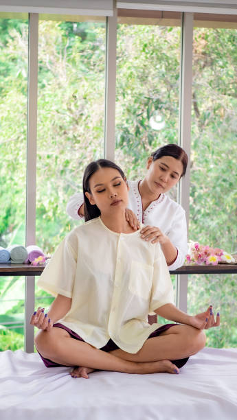 istock A beautiful girl happiness in spa with Thai massage 1299266959