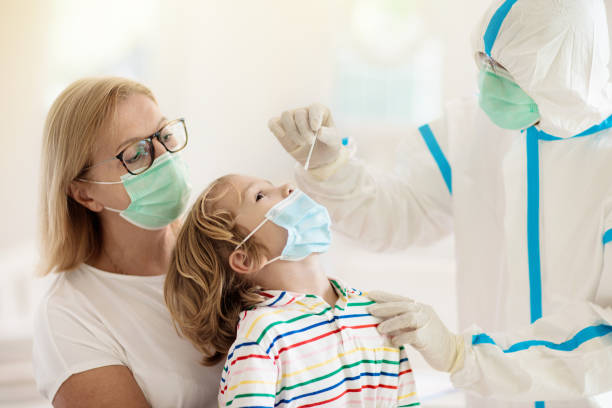 istock Coronavirus swab test. Doctor and Covid-19 patient 1299268996