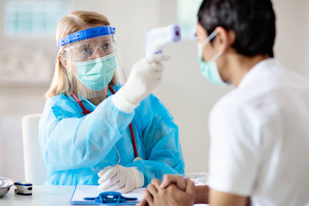 istock Coronavirus outbreak. Doctor and covid-19 patient. 1299269074