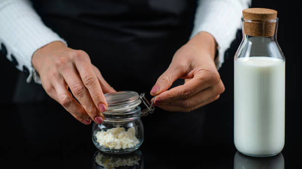 istock Woman Preparing Homemade Kefir, a Fermented Dairy Drink 1299272833
