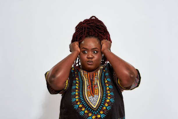 istock Confused plump woman with eyes looking to side 1299272985