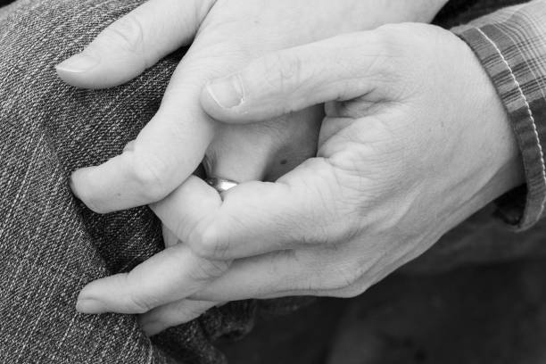 istock Black and white Lovers couple holding hands 1299273047