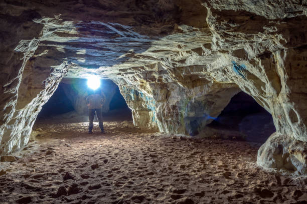 istock A gallery of sandstone cave illuminated by headlamp counter light 1299277852