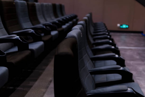 istock Empty comfortable seats with numbers in cinema 1299279011