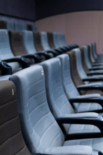 istock Empty comfortable seats with numbers in cinema 1299279326