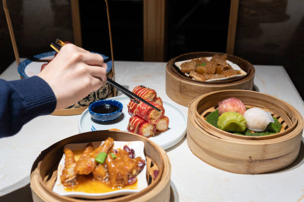 istock A hand taking the Guangdong dum sum named Red Shrimp Chee Cheong Fun with chopsticks 1299279737