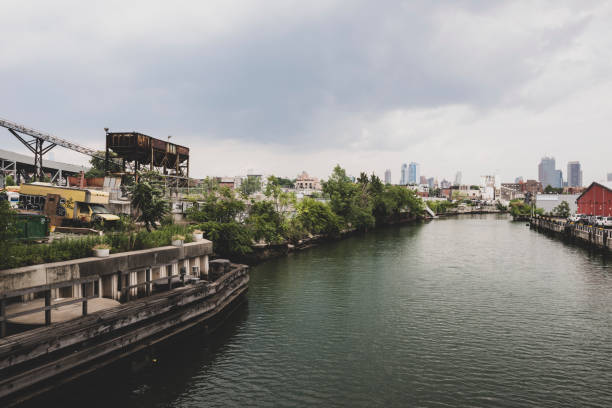 New York City, USA - July 7, 2016: View of the Gowanus Canal from the 9th Street bridge in Brooklyn. One of the most polluted waterways in the United States, it was designated a Superfund site in 2009.