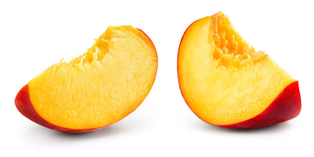 istock Peach slice isolate. Peach on white background. Sliced peach isolated. With clipping path. 1299284003