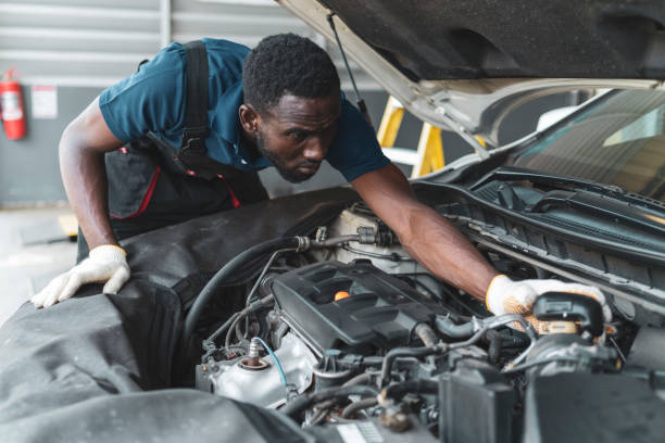 istock African mechanic working in the garage 1299285680