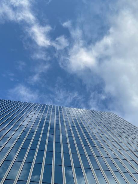 istock Tall urban office buildings in blue sky 1299286672