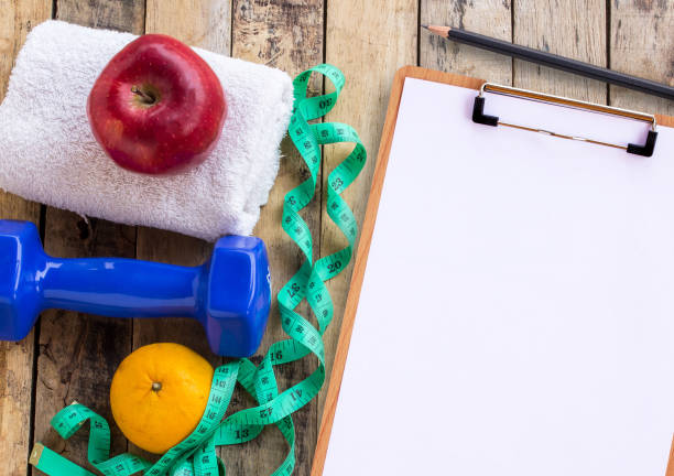 istock Medical form with blue dumbbell, white towel 1299286950