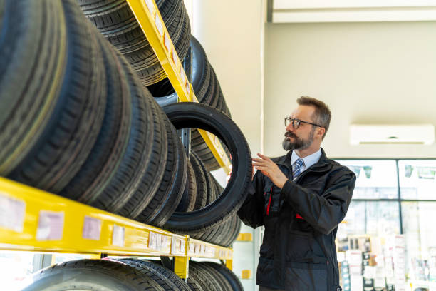 istock Professional mechanic working in the garage 1299286997