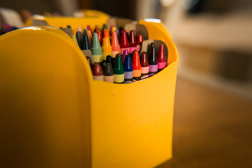 Crayon box with crayons visible