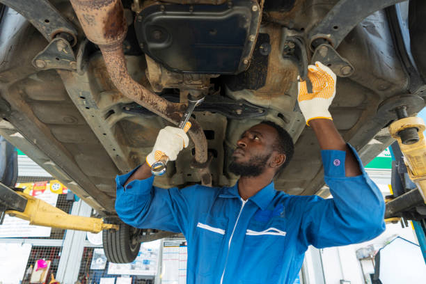 African mechanic working in the garage