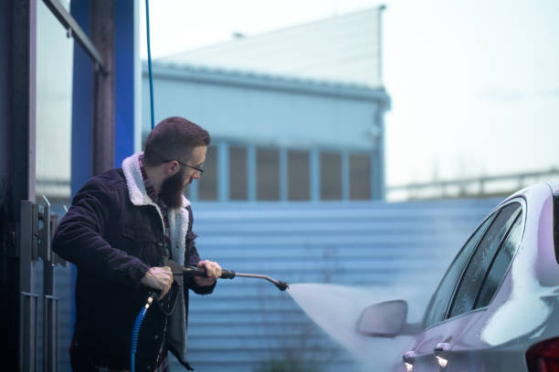 istock Young man washing his car 1299288557