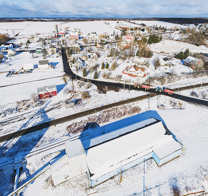 Aerial view of disused barn/grain silos in a small rural community.