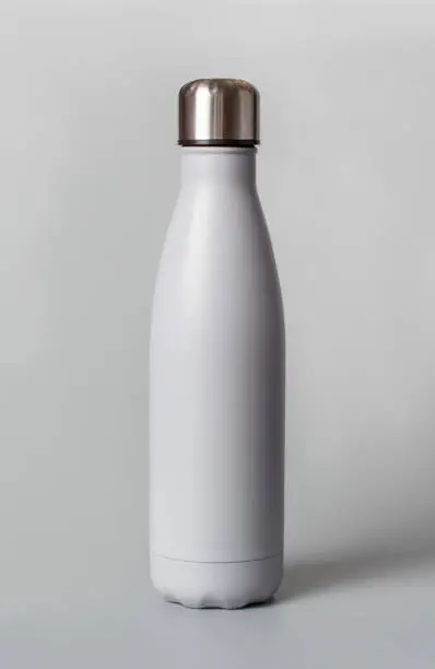 Photo of Grey reusable bottle on grey background