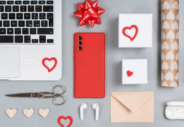 istock Wrapping valentines day presents near modern gadgets 1299291087