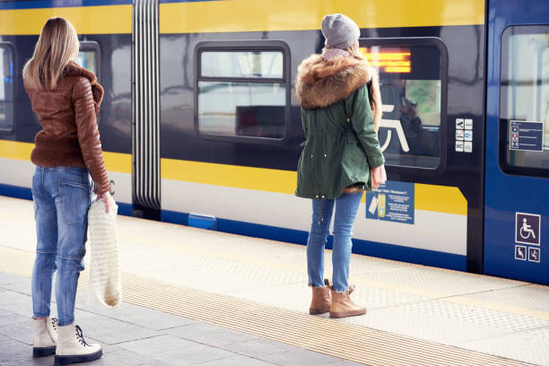 istock People keeping social distance at train station 1299292739