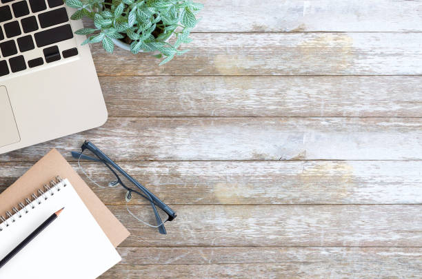 istock Office supplies and Laptop computer,smart phone,glasses,notebook and fresh flowe 1299293304