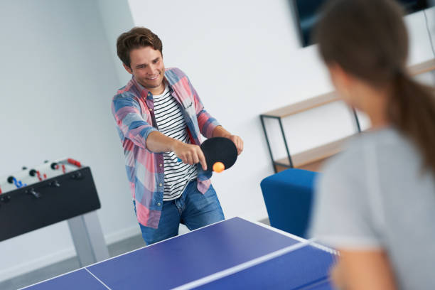 istock Group of students playing table tennis in the campus 1299294443
