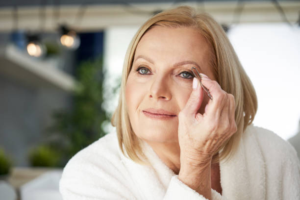 istock Senior woman in the bathroom 1299294622