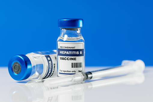 hepatitis b virus vaccine vials and syringe