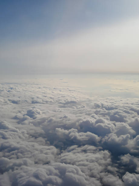 istock Clouds view from the airplane window. The sky is with cumulus clouds. Beautiful background. Travels. Flying over the cloud. To fly 1299296058
