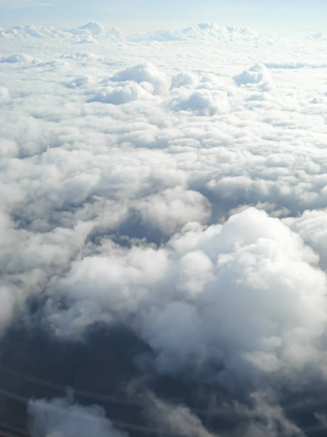 istock Clouds view from the airplane window. The sky is with cumulus clouds. Beautiful background. Travels. Flying over the cloud. To fly 1299296063