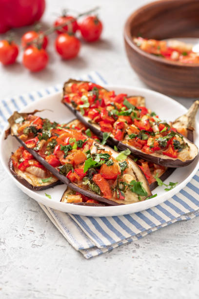 istock Baked eggplant with tomatoes and peppers in a plate 1299298310