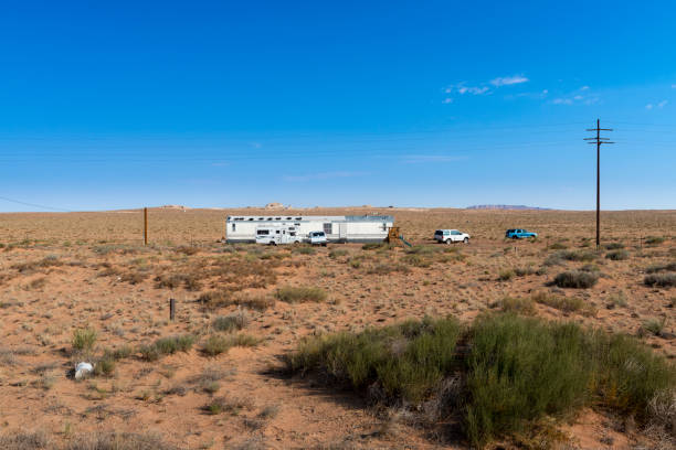 A mobile home in the desert near Kayenta, in the Navajo County, State of Arizona Kayenta, Arizona - July 17, 204: A mobile home in the desert near Kayenta, in the Navajo County, State of Arizona, USA. kayenta photos stock pictures, royalty-free photos & images