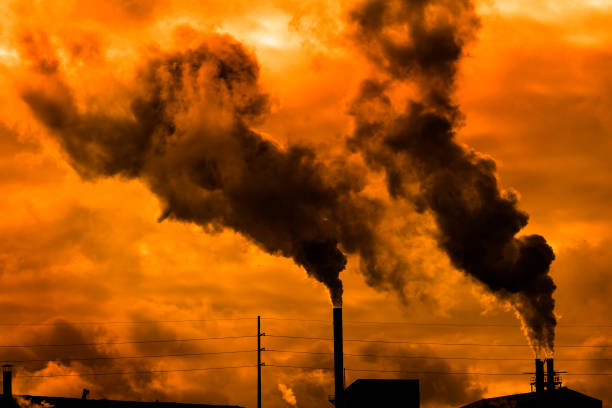 istock Pollution rising from factory smoke smokestack chimney environment 1299300594