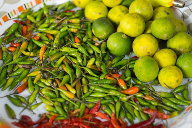 istock Many small thai chilies and lemon fruits 1299303529