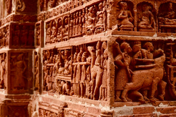 Traditional concrete sculptures on a wall of temple