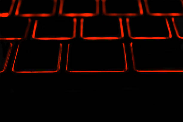 istock Black laptop keyboard with red lights unique photo 1299304800
