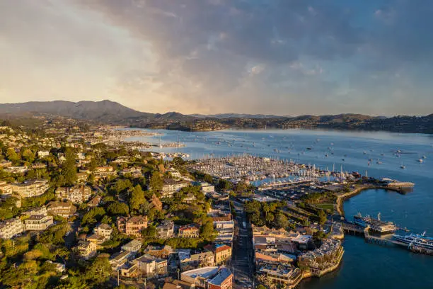 Aerial view of sunrise over Sausalito Marina with a view of Tiburon and the San Francisco Bay.