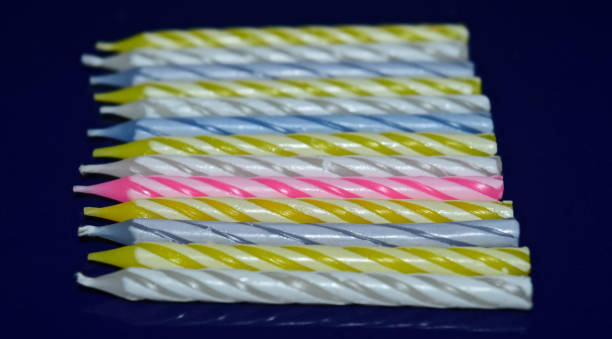 istock Colourful small candles with textures photo 1299304962