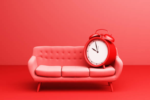 Red Alarm Clock with red Simple Modern Sofa Furniture on a red background. 3d Rendering