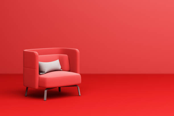 istock Red armchair fabric with white pillow on red background 3d rendering 1299305960