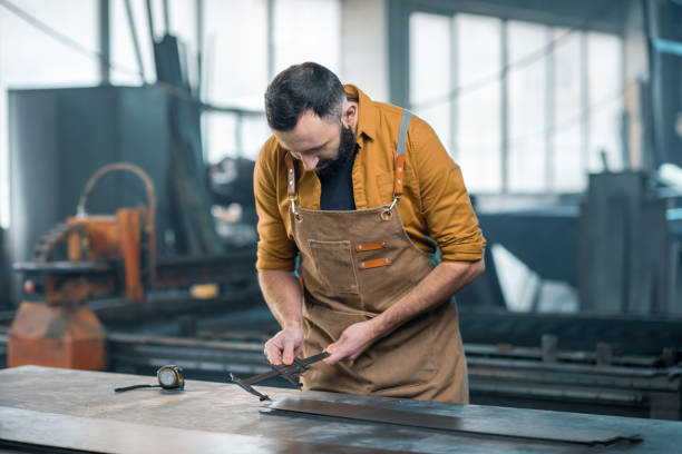 istock Metal industry worker at factory 1299306194