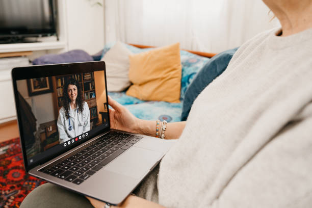 istock Female doctor is visiting a patient on a video call 1299306704