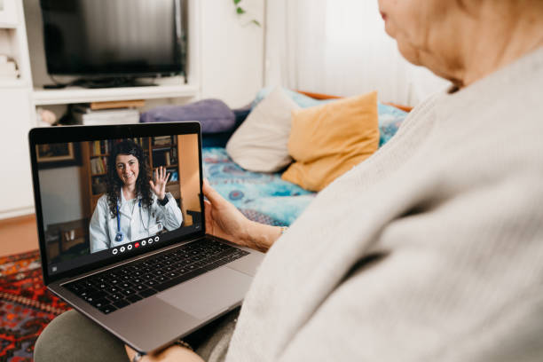 istock Female doctor is visiting a patient on a video call 1299306707
