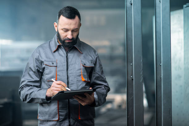 istock Worker with a digital tablet at the plant 1299307373